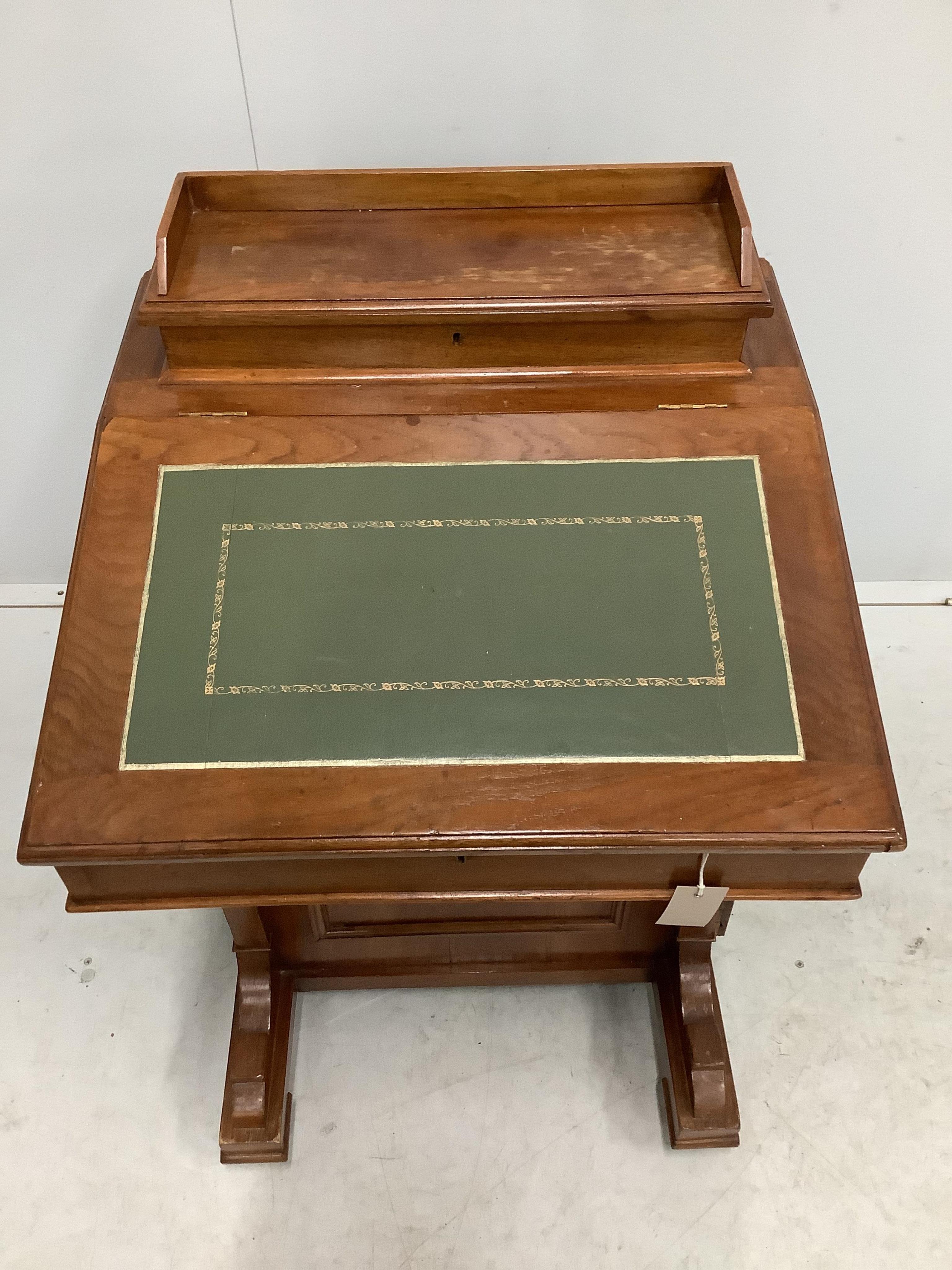 A late Victorian walnut Davenport, width 55cm, depth 53cm, height 87cm. Condition - fair